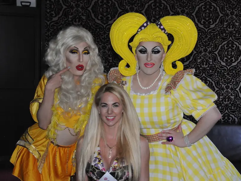 boomtown two drag queens standing beside bree maddox
