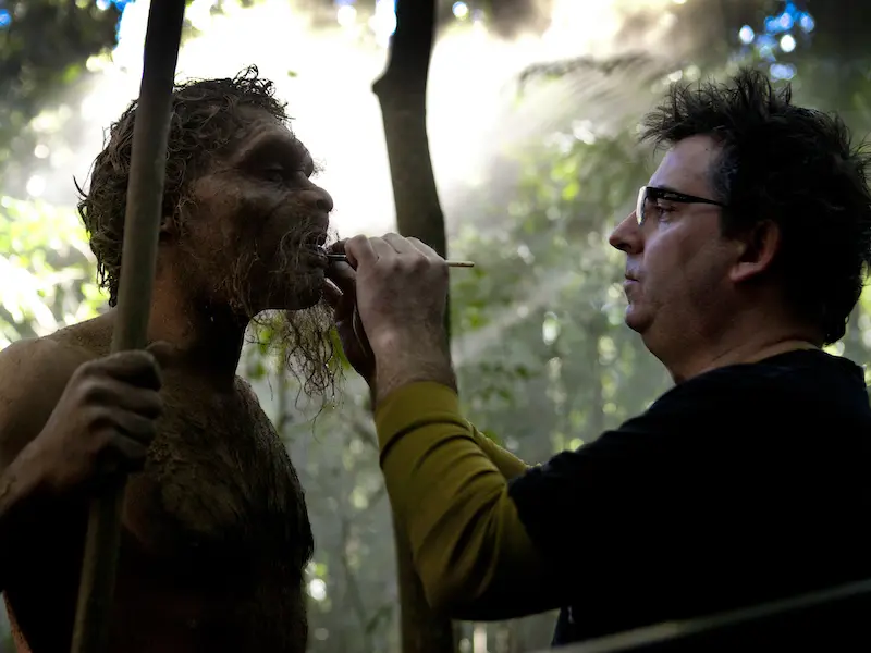 Prosthetics being applied to ancient human on set of documentary