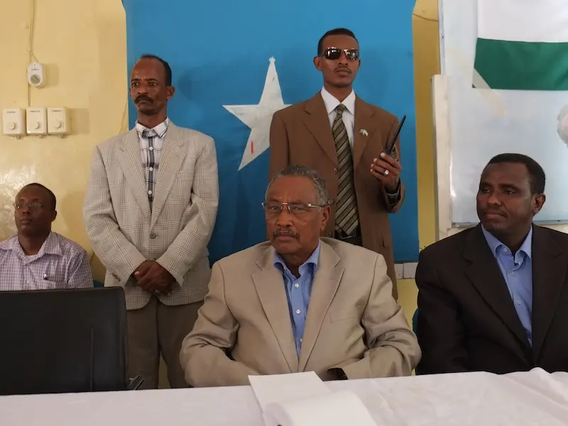 Farole sitting with Puntland Government Ministers at official event