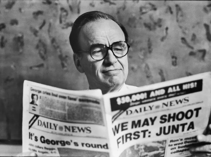 New York Post owner Rupert Murdoch reading the Daily News