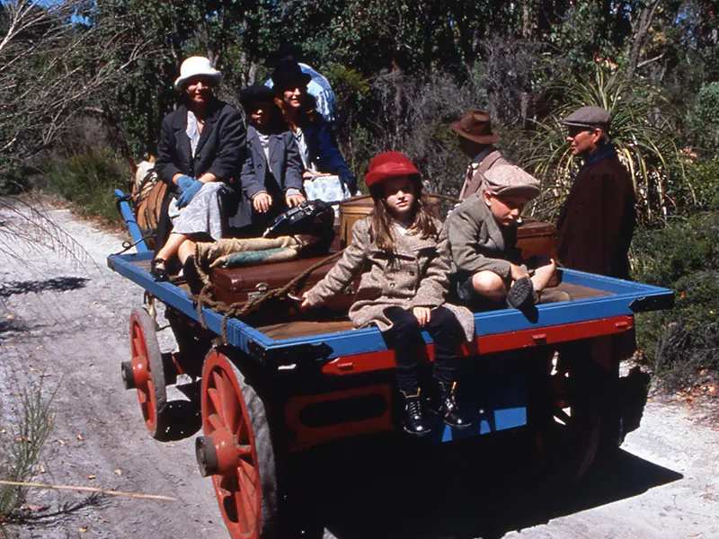 Horse drawn cart takes group of British settlers to their farm in Western Australia