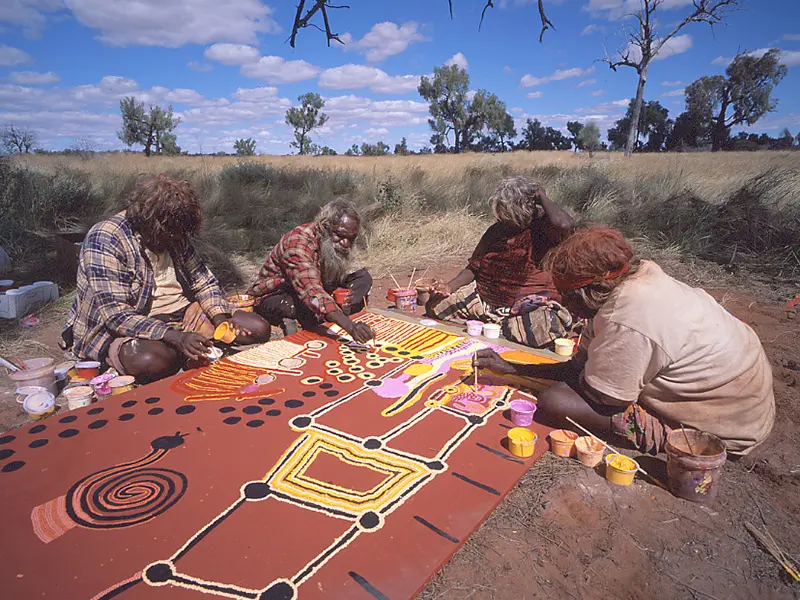 Nyumi, Helicopter, Lucy and Eubena painting a group painting