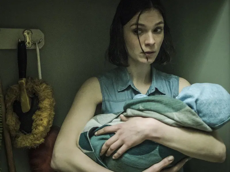 Actor Tilda Cobham Hervey hiding in cupboard with baby in film Hotel Mumbai