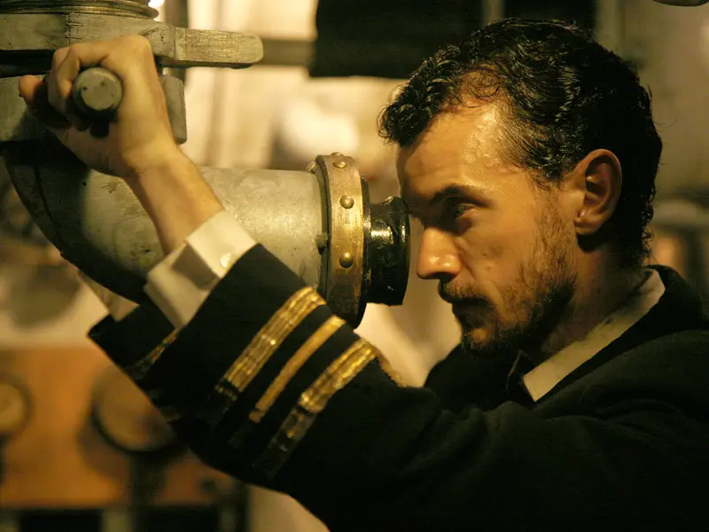 Actor David Smyth as Lieutenant Commander Stoker looks through AE2 submarine periscope