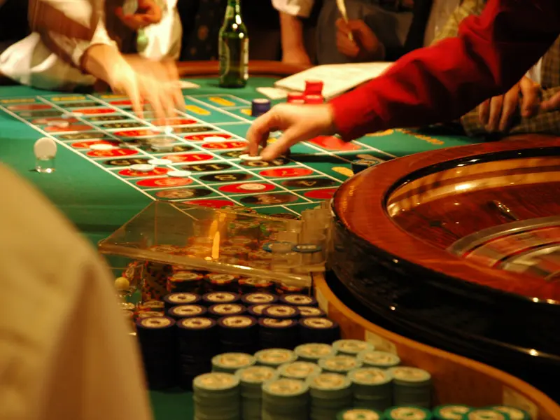 Action shot of roulette table with chips in casino