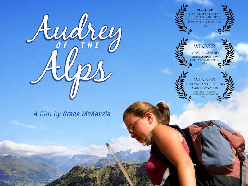 a young woman sheep herder in the Alps